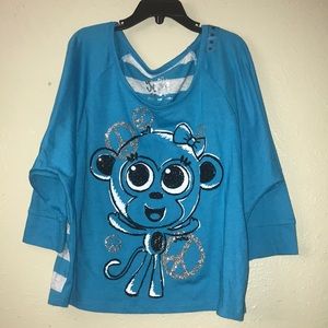 Justice,girls blue monkey print top. Size 10.